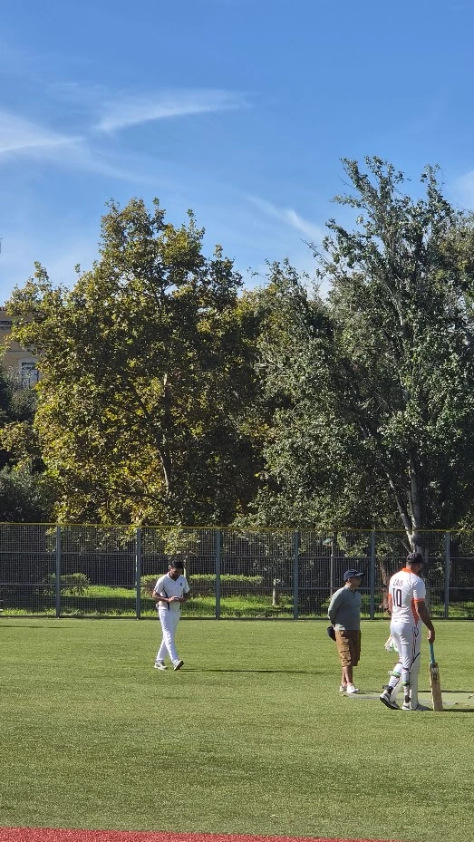 Cricketers on a grass field in Valencia